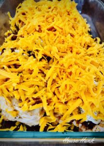 shredded cheese topping in a casserole dish