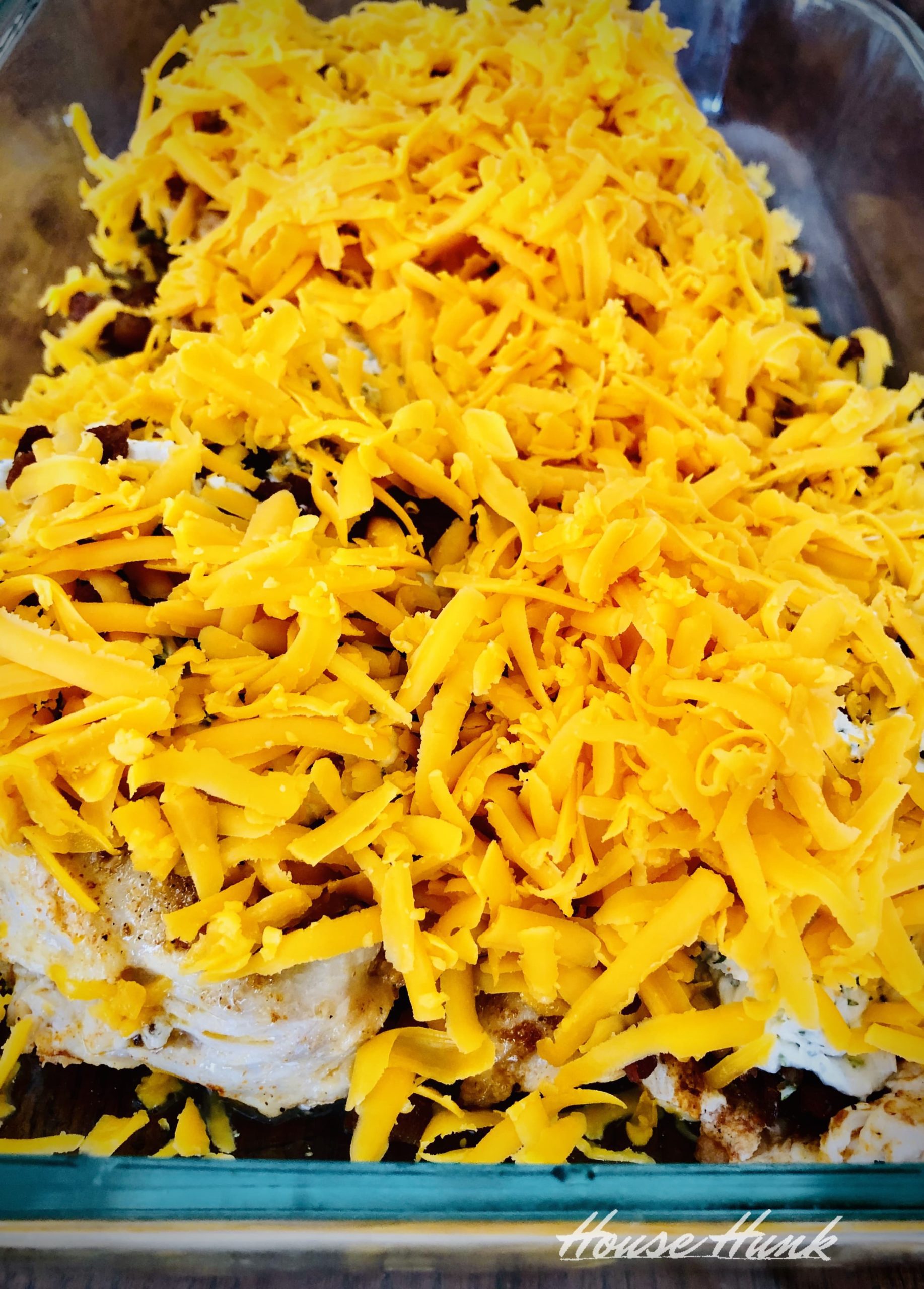 shredded cheese topping in a casserole dish