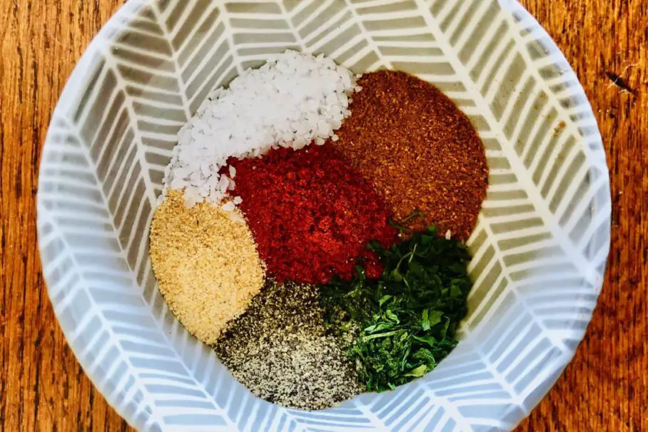 parsley, black pepper, paprika, garlic powder, cayenne pepper, and salt in a bowl