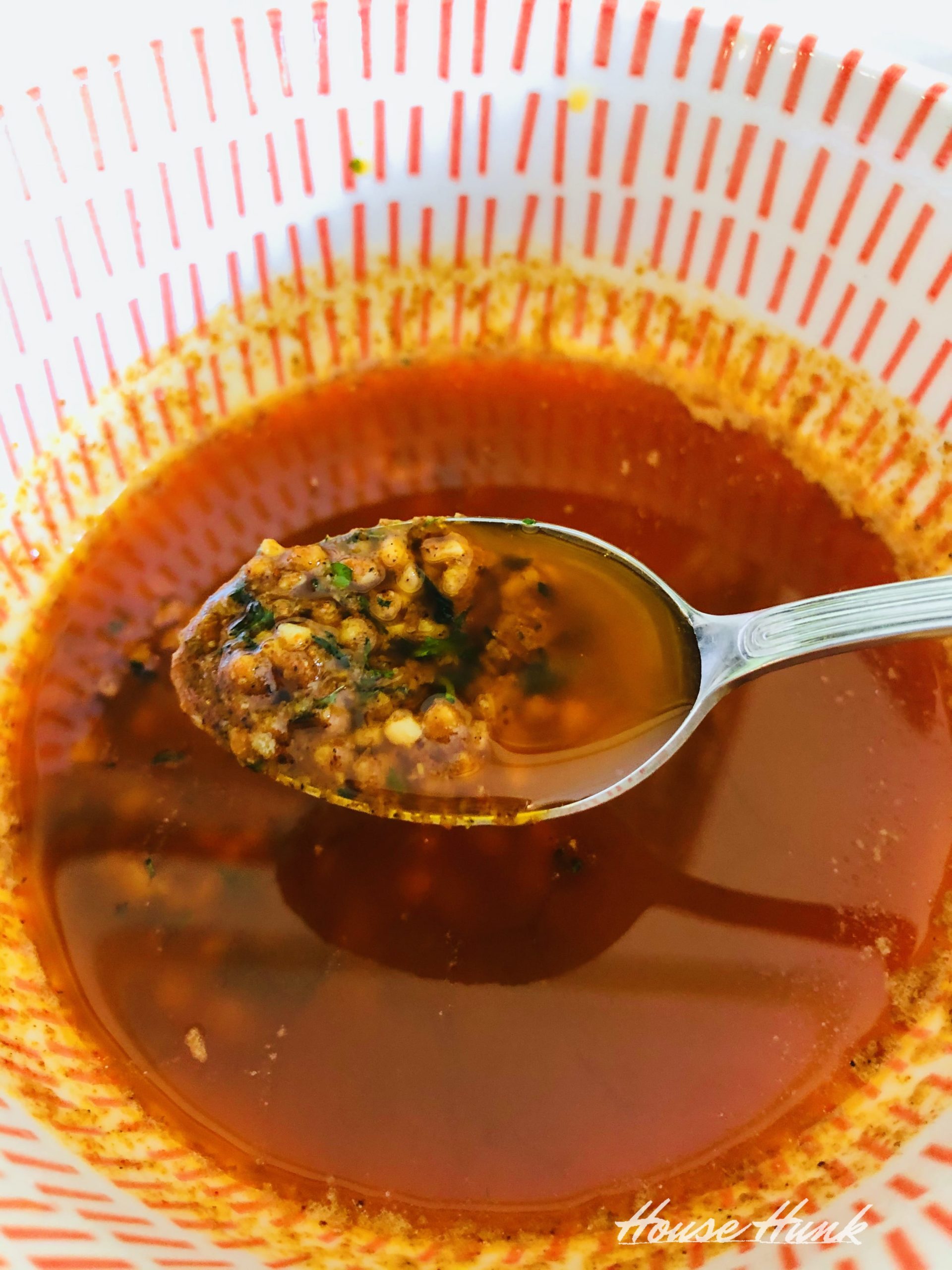 spoonful of cajun butter in a bowl