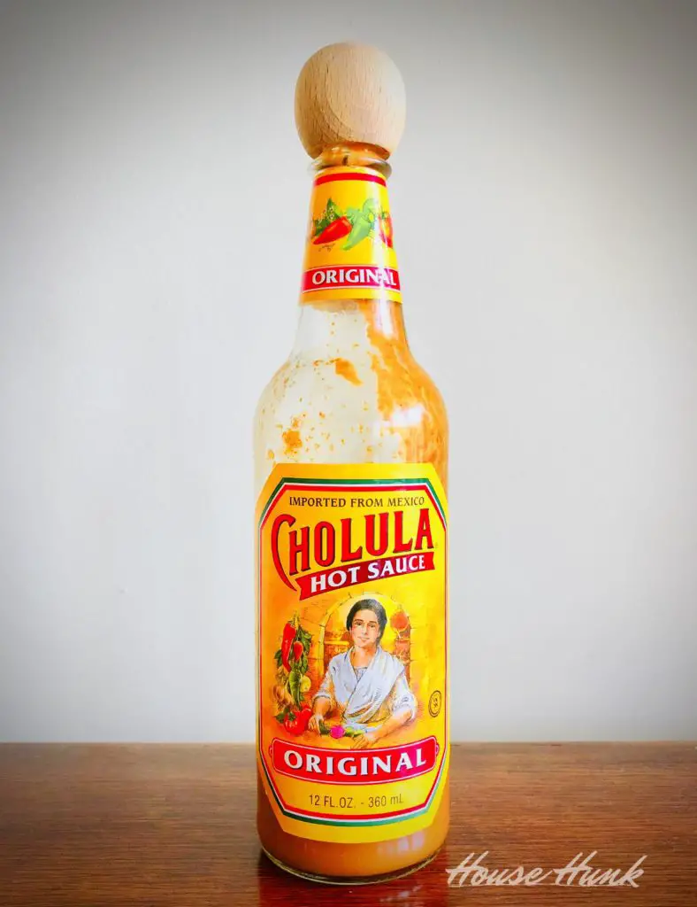 bottle of cholula sauce on a table