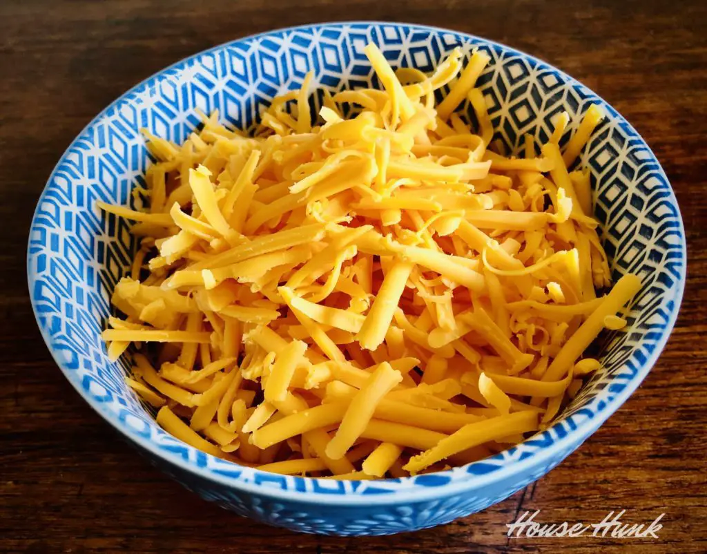 shredded cheddar cheese in a bowl