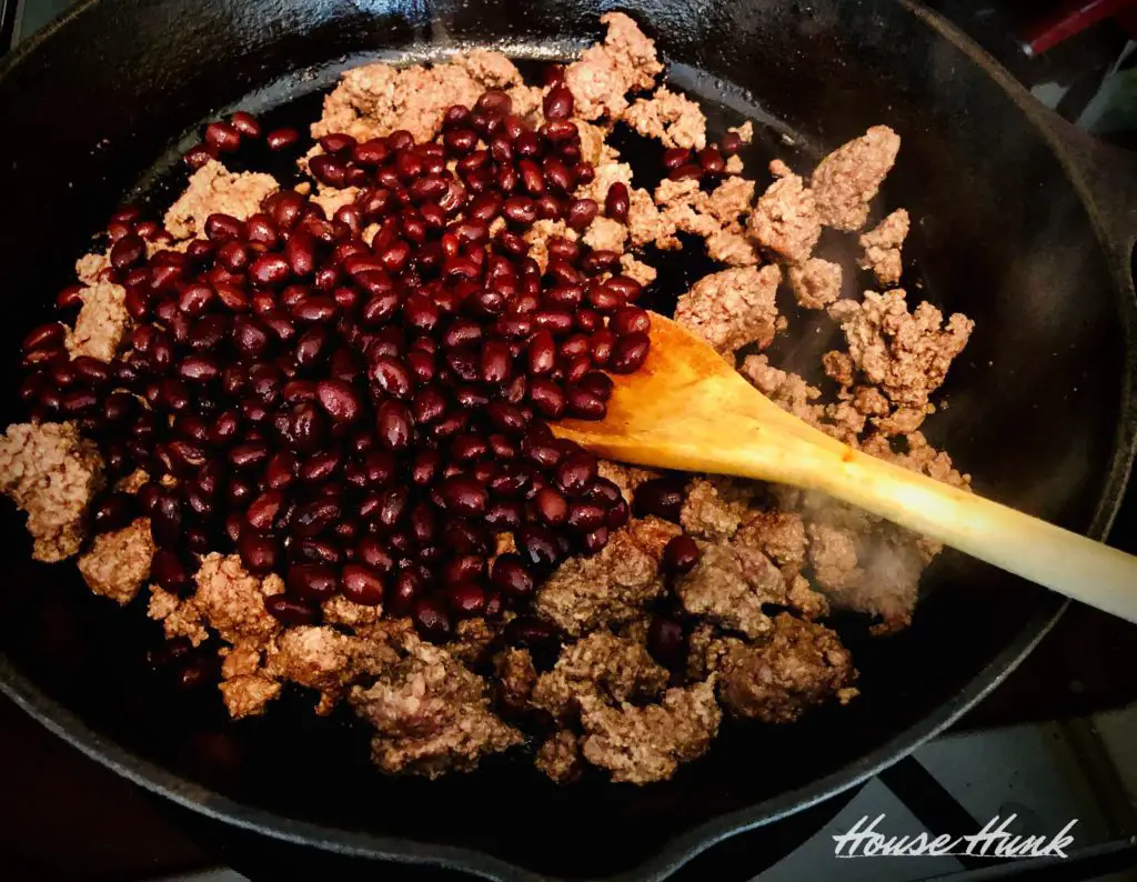 ground beef and black beans in a pan