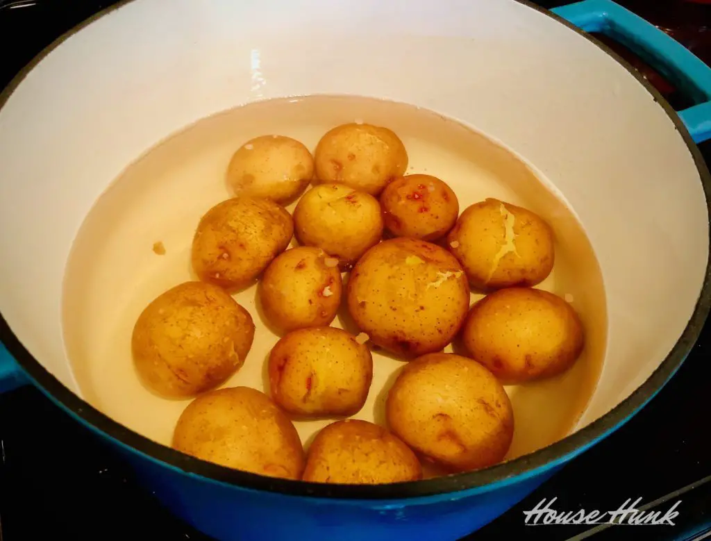 boiled potatoes in a blue dutch oven