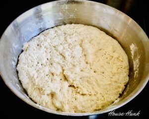 pizza dough after rising in bowl