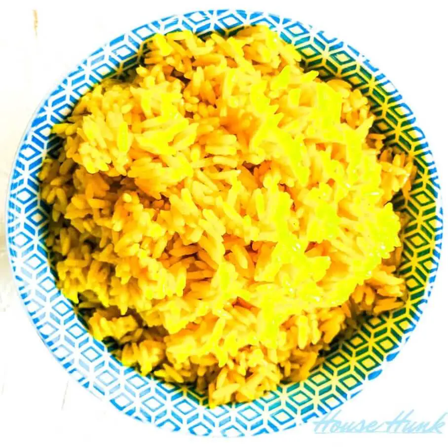 A bowl of yellow rice.