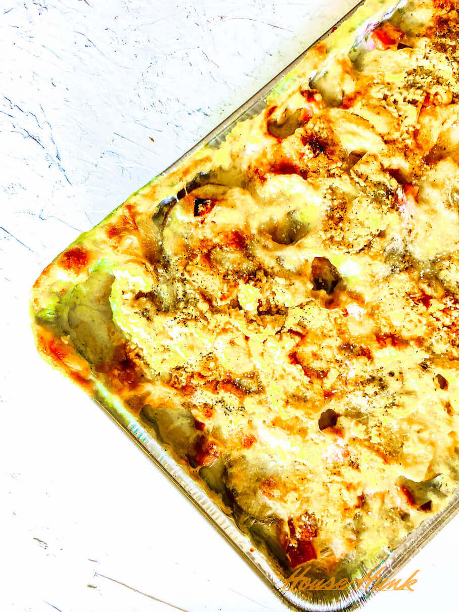 The best ham and scalloped potatoes in an aluminum baking tray.