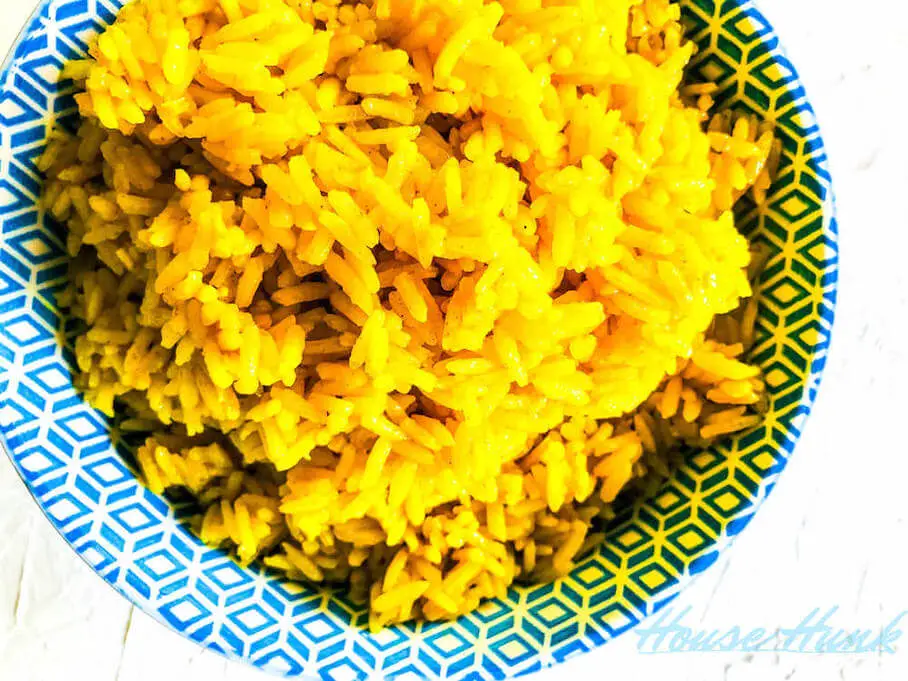 A bowl of yellow turmeric basmati rice.