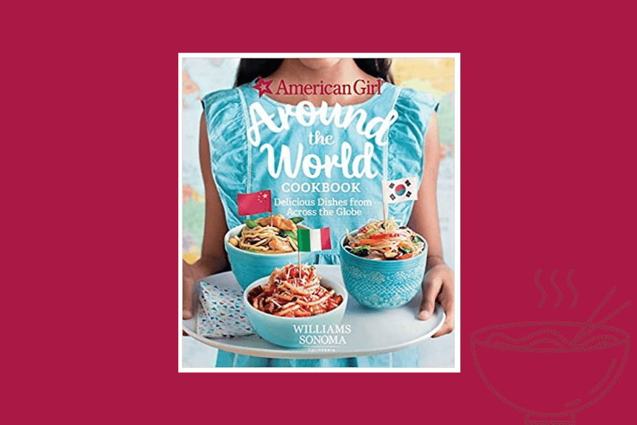 An image of a cookbook cover. The title is “American Girl Around the World Cookbook: Delicious Dishes from Across the Globe”. The cover features a girl holding a tray with two bowls of pasta. The background is pink with a white border. The publisher is Williams Sonoma. The cover also has a red star and a blue globe icon.