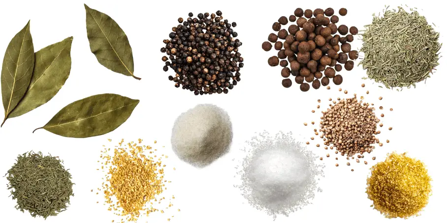 A photorealistic image of ingredients for Homemade Homemade All-Purpose Brine Seasoning consisting of ten piles of different spices and herbs on a white background.