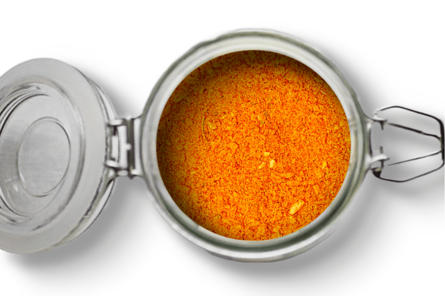 A photo of an open jar of homemade burger seasoning on a white background.