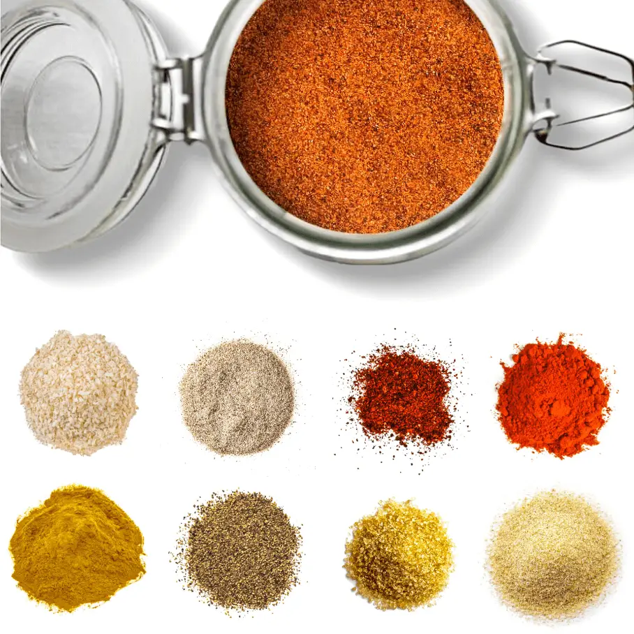 A photo of a glass jar of spice mix surrounded by piles of different spices on a white background.