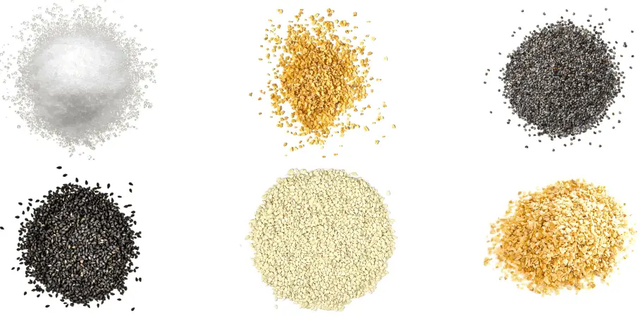A photorealistic image of ingredients for Homemade Everything Bagel Seasoning consisting of six piles of different spices and herbs on a white background.