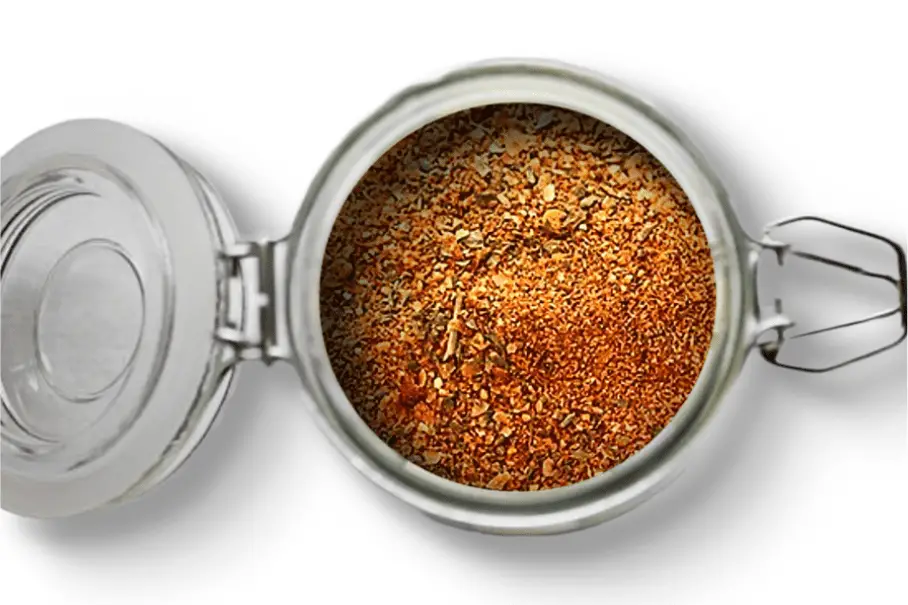 A photo of an open jar of homemade paella seasoning on a white background.
