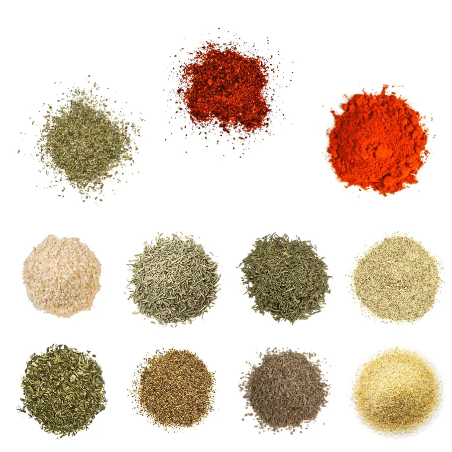A photorealistic image of ingredients for Homemade Jambalaya Seasoning consisting of eleven piles of different spices and herbs on a white background.