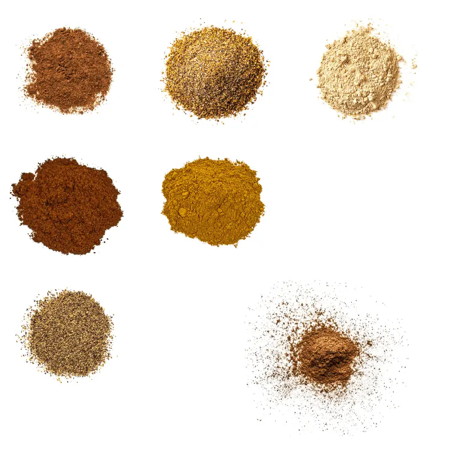 A photorealistic image of ingredients for Homemade Lebanese 7 Spices Seasoning consisting of nine piles of different spices and herbs on a white background.