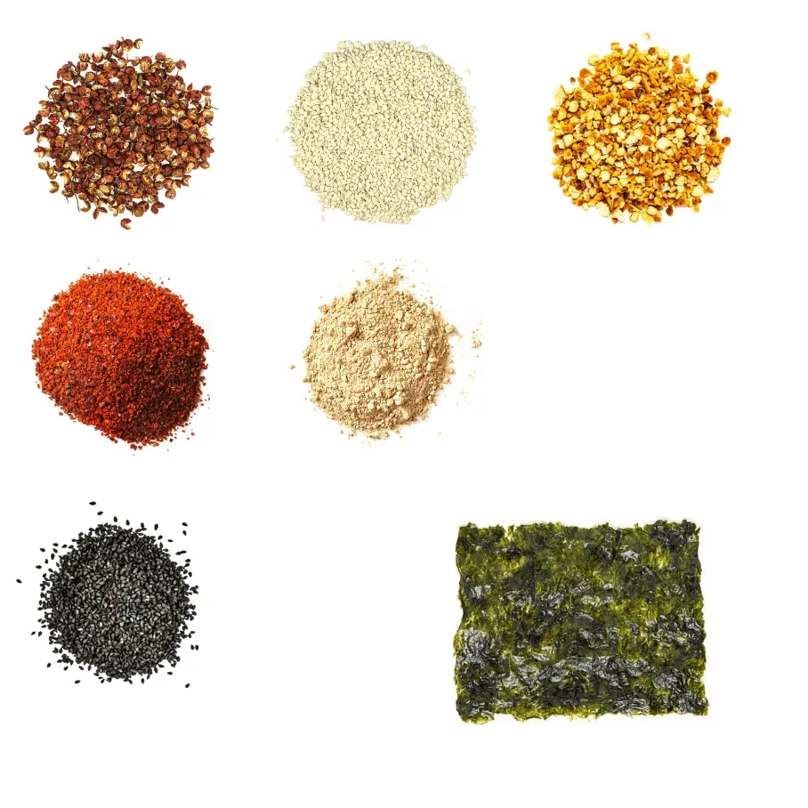 A photorealistic image of ingredients for Homemade Shichimi Togarashi consisting of seven piles of different spices and herbs on a white background.