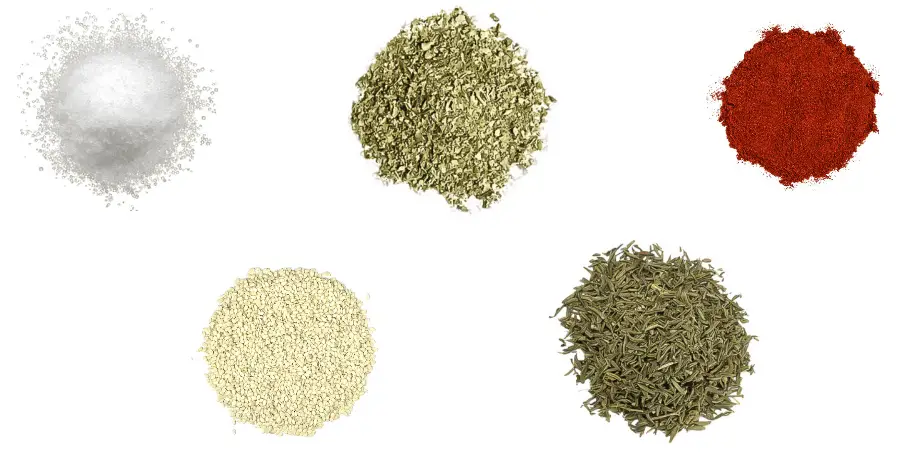 A photorealistic image of ingredients for Homemade Za’atar Seasoning consisting of four piles of different spices and herbs on a white background.
