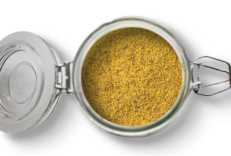 A photo of an open jar of homemade lemon pepper seasoning on a white background.