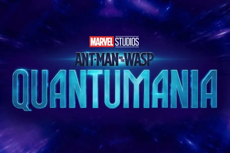 A promotional image for the Marvel Studios film “Ant-Man and the Wasp: Quantumania”. The image is a dark blue background with a purple and blue nebula-like design. The text “Marvel Studios” is in red and white, and “Ant-Man and the Wasp” is in white. The text “Quantumania” is in a light blue, futuristic font. The text is centered in the image.