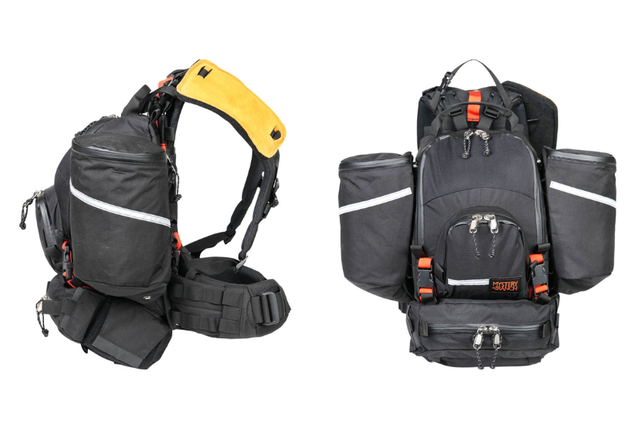 Two black Mystery Ranch SHIFT Packs on a white background