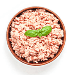 A photo realistic image of a bowl of ground turkey meat with a basil leaf on a white background.