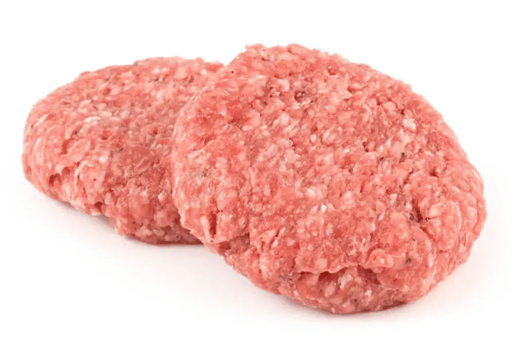 A photo realistic image of two raw veal patties on a white background.