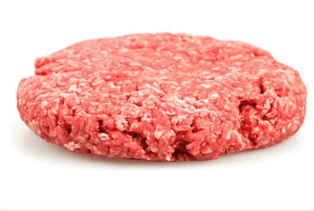 A photo realistic image of a raw veal patty on a white background.