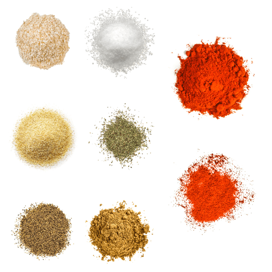 A photorealistic image of ingredients for Homemade Baja Seasoning Recipe consisting of eight piles of different spices and herbs on a white background.