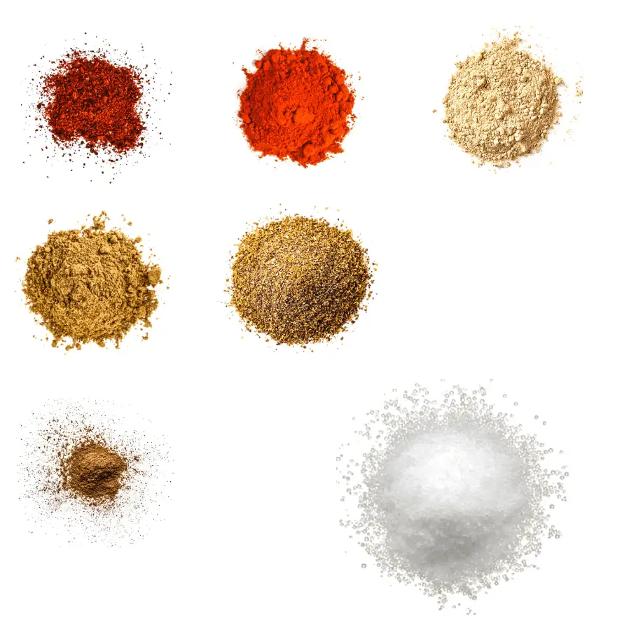 A photorealistic image of ingredients for Homemade Casablanca Seasoning consisting of seven piles of different spices and herbs on a white background.