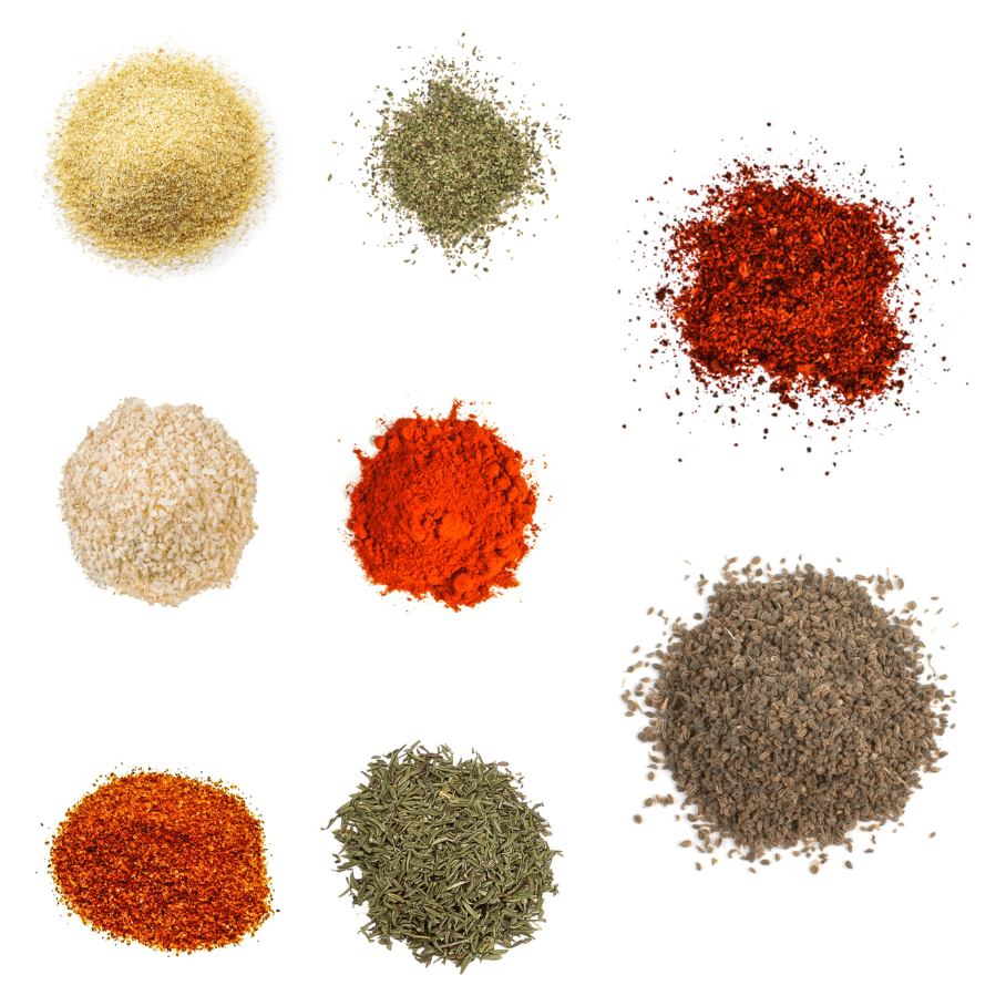 A photorealistic image of ingredients for Homemade Chesapeake Bay Seasoning consisting of eight piles of different spices and herbs on a white background.