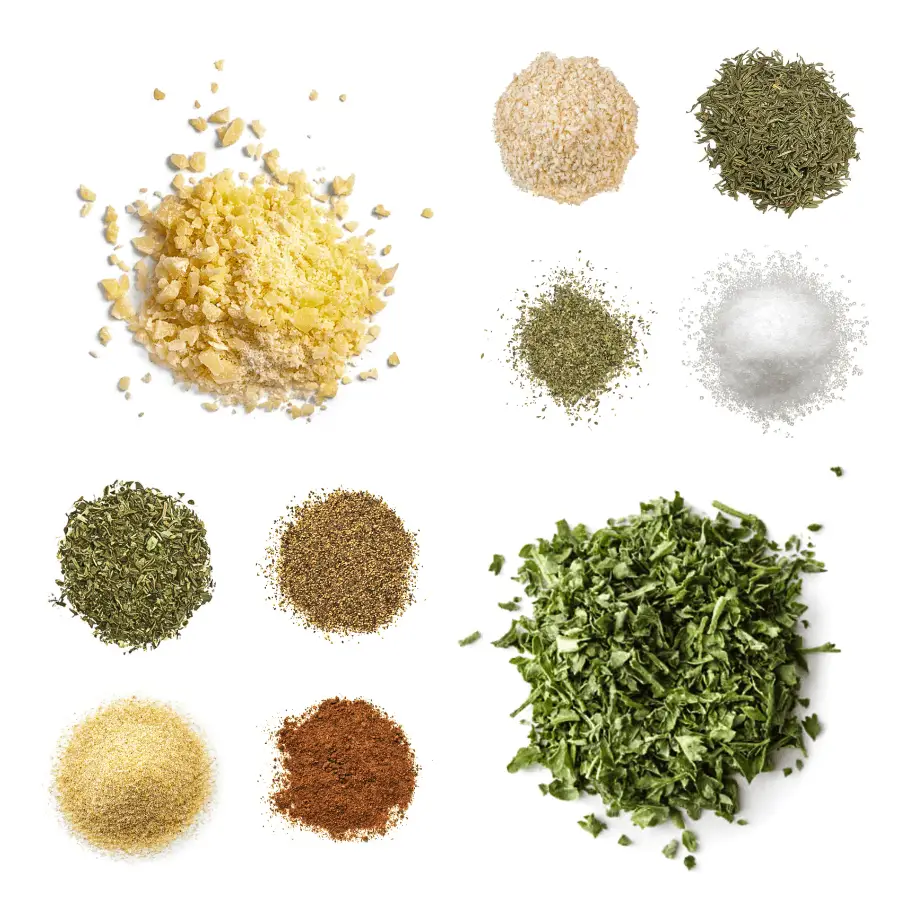 A photorealistic image of ingredients for Homemade Alfredo Seasoning consisting of ten piles of different spices and herbs on a white background.