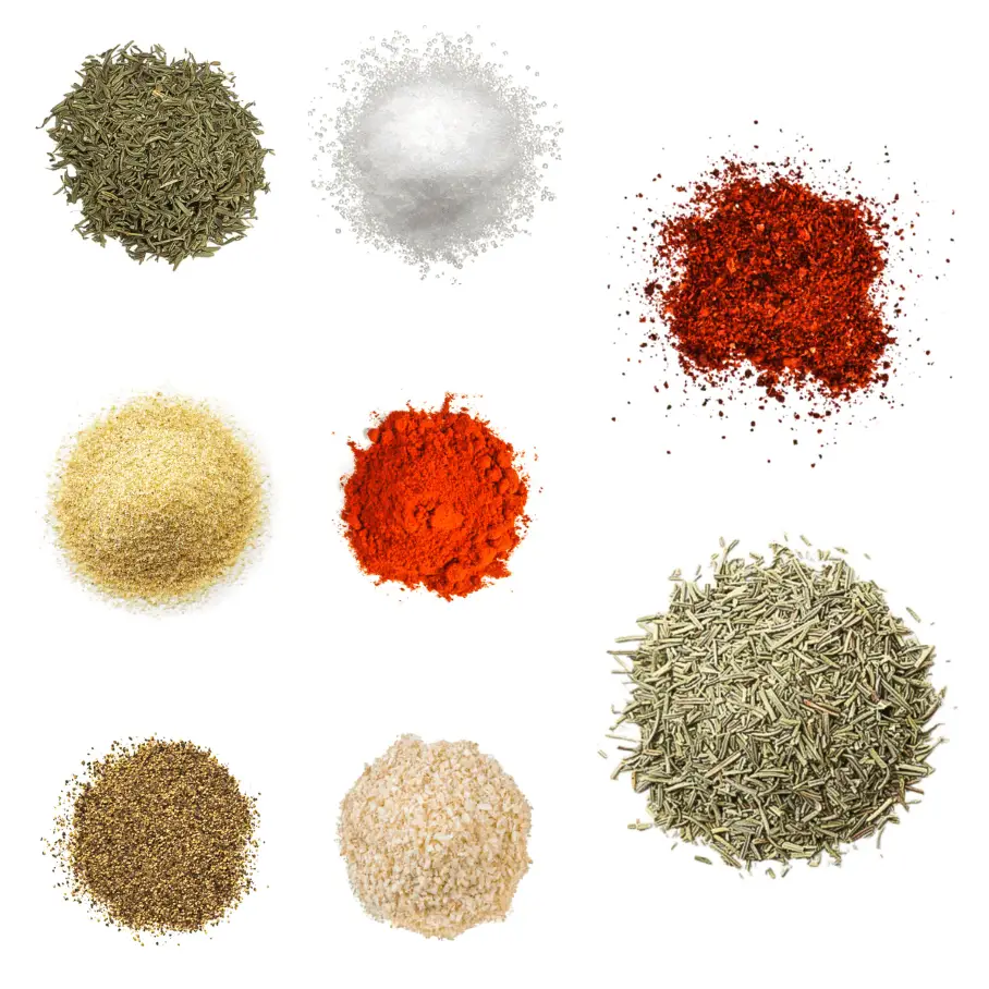 A photorealistic image of ingredients for Homemade Steak Seasoning consisting of eight piles of different spices and herbs on a white background.