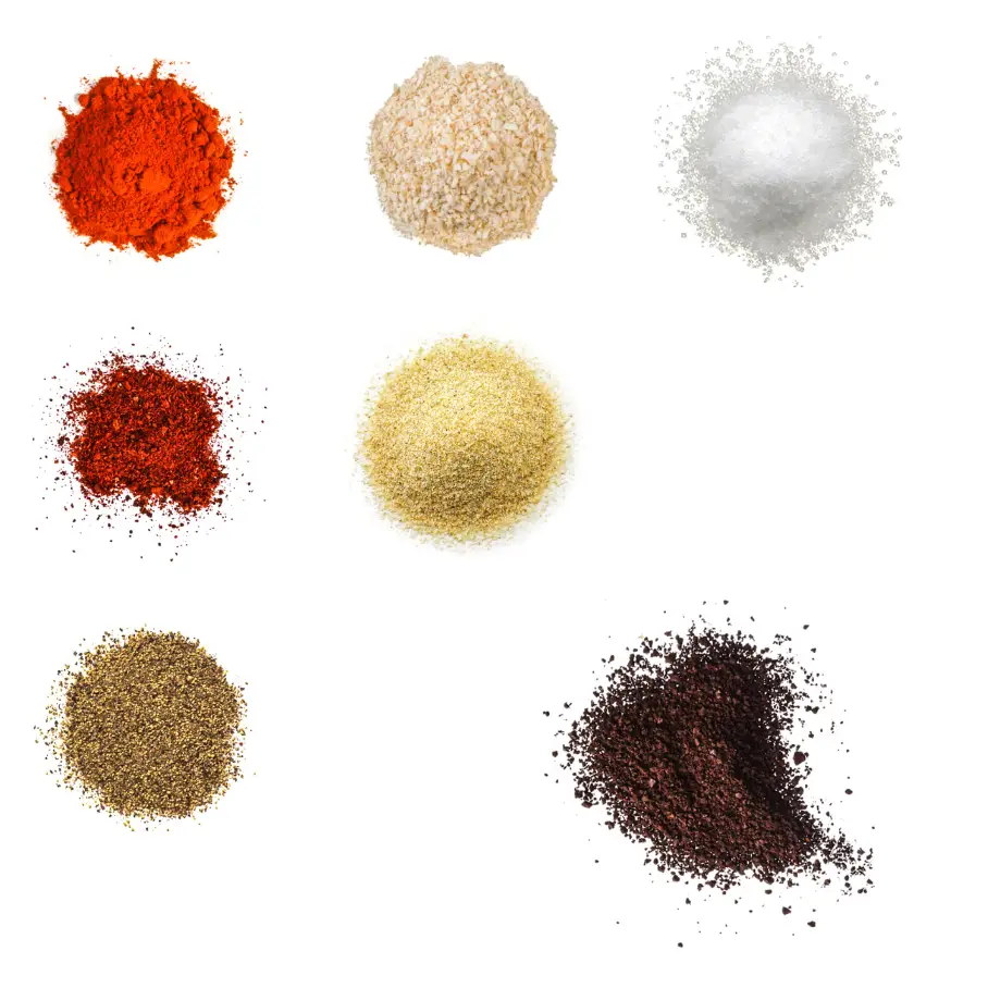 A photorealistic image of ingredients for Homemade Espresso Rub consisting of seven piles of different spices and herbs on a white background.