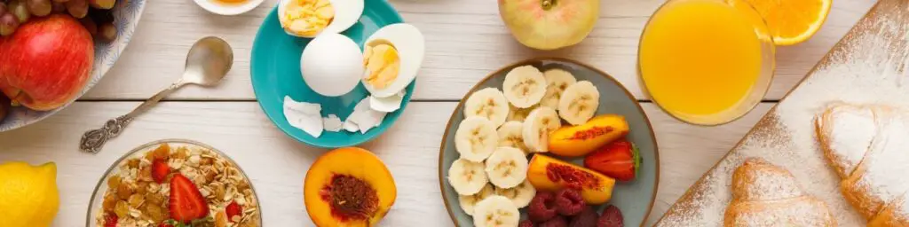 a plate of fruit and eggs